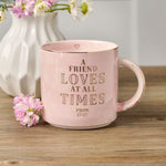 Inscribed Pink Marbled Friendship Ceramic Coffee Mug with Flowers in Vase in Background