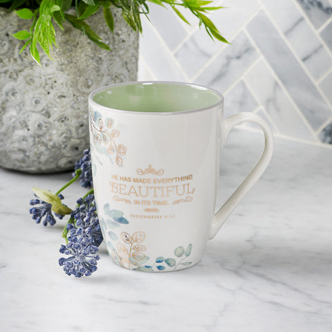 Blue-Green Floral Ceramic Coffee Mug with Lavender Flower and Background Plant