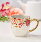 Red and Orange Marigold Ceramic Tea Cup with Floral Background