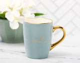 It Is Well With My Soul Soft Blue and Gold Ceramic Coffee Mug with White Flower in Background - Close-up