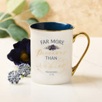 White and Blue Floral Ceramic Coffee Mug with Inscription with Flowers to the Side of Mug.