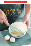 Wooden Handle Silicone Cooking Utensil - Whisking an Egg