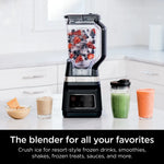 Ninja Professional Plus Blender with ice and fruit, along with smoothies surrounding.