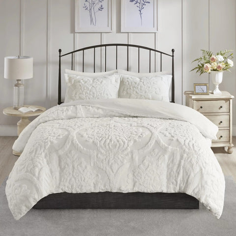 White Cotton Bedding Duvet Cover Set Displayed with Nightstands on Either Side of Bed with Black Iron Headboard.